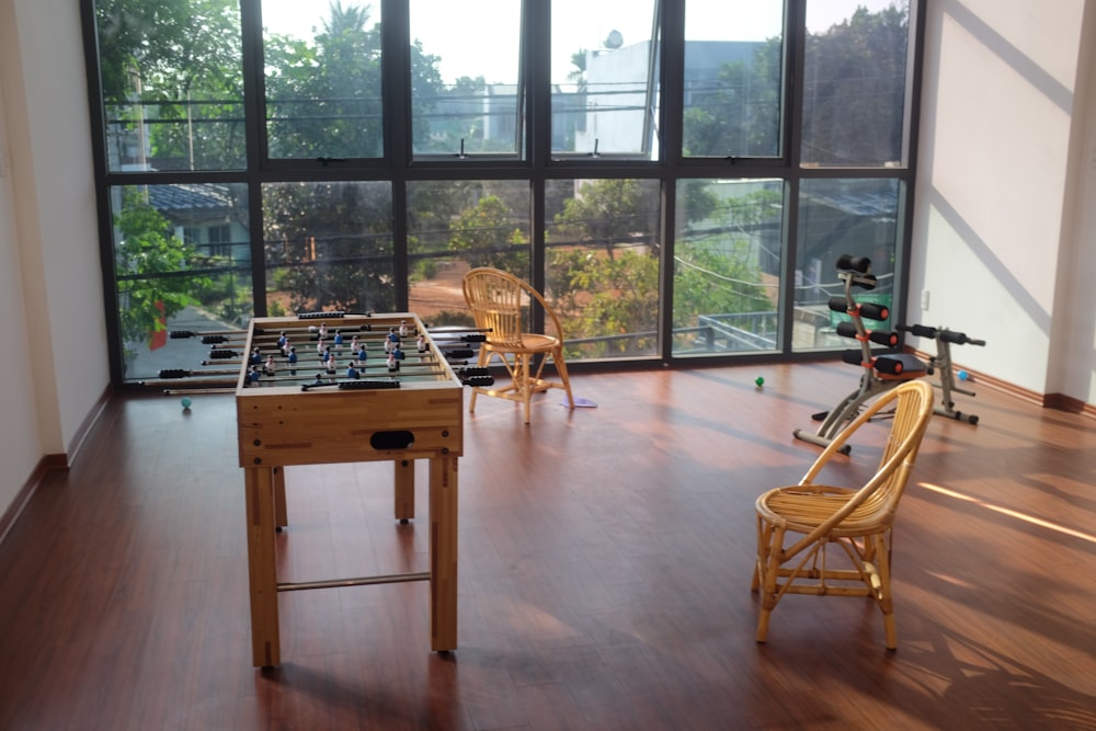 a room with a foosball table and a foosball table