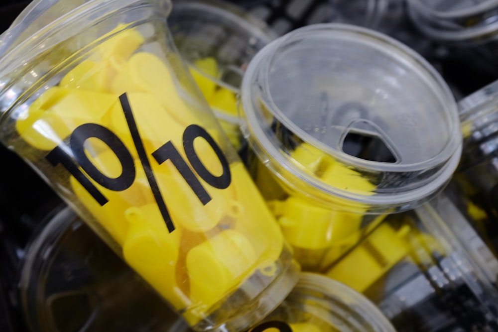 a close up of a jar of yellow pills
