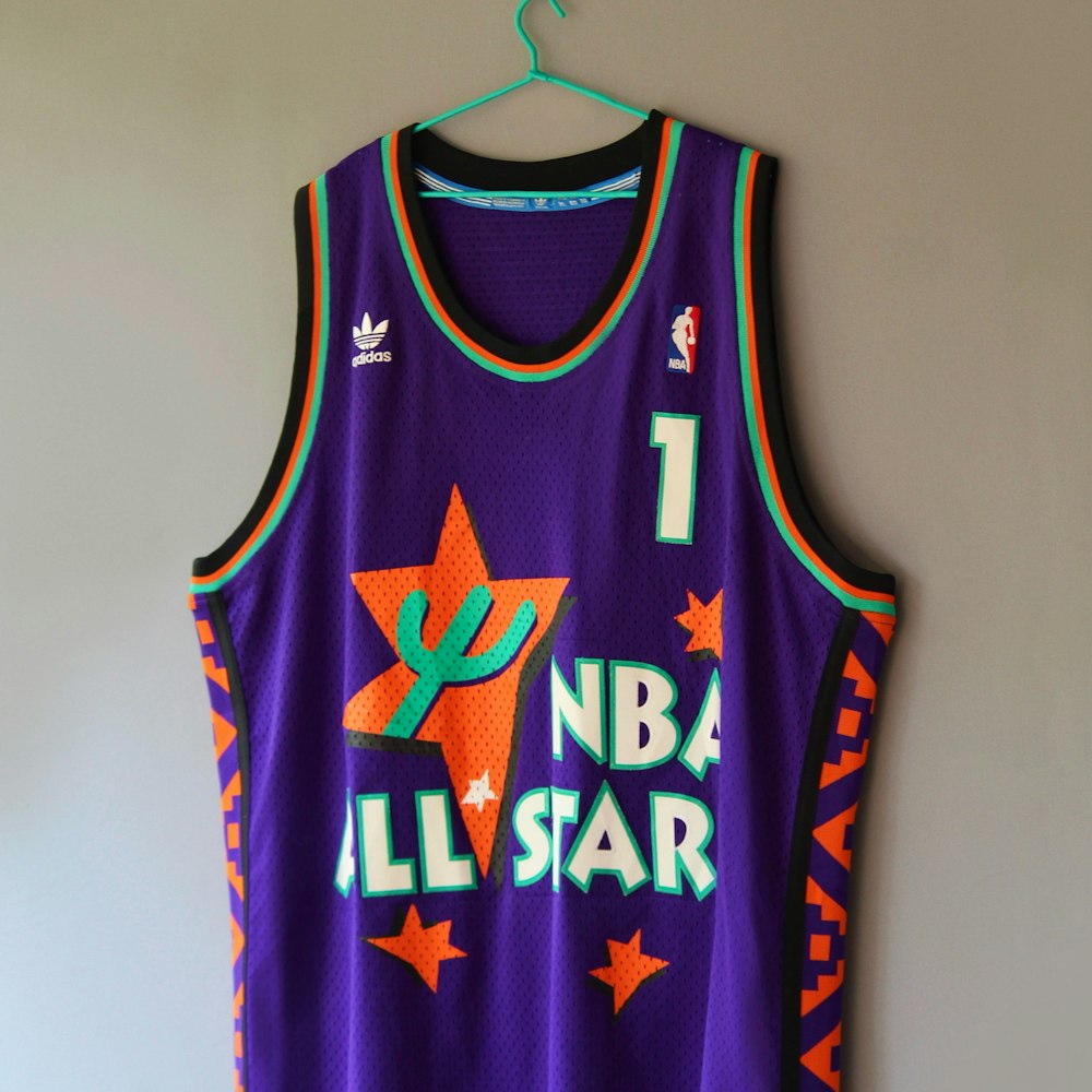 a basketball jersey hanging on a wall