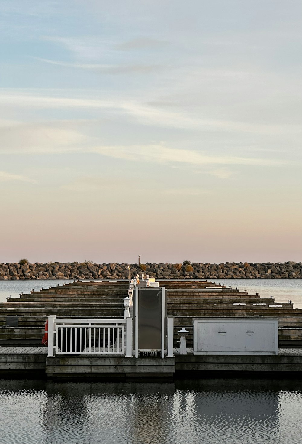 a large body of water sitting next to a pier