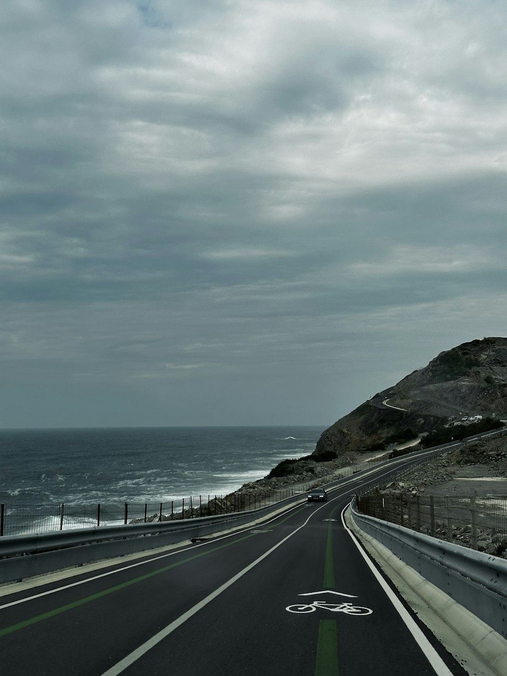 a view of the ocean from a highway