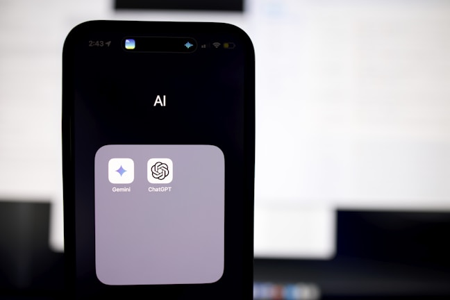 a close up of a cell phone with an ai button