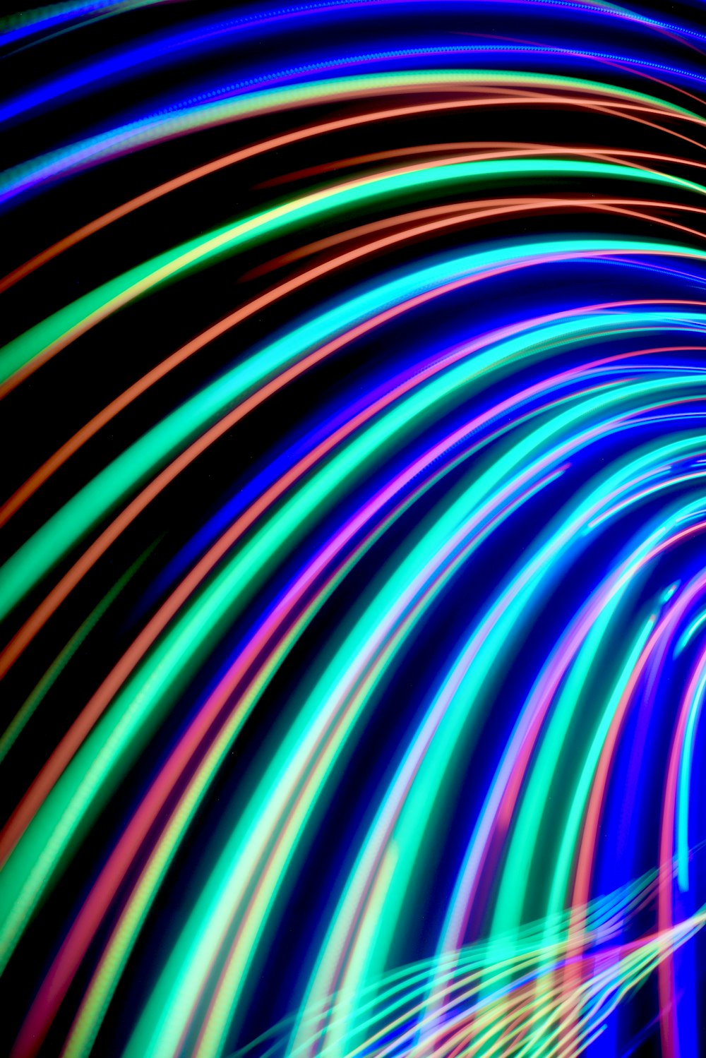 a colorful tunnel of light with a black background