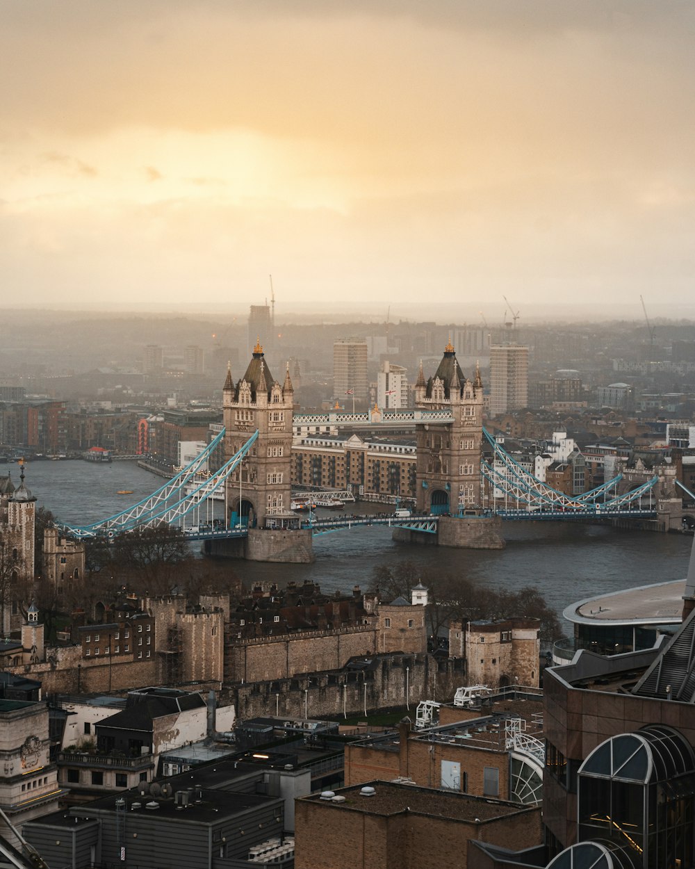 a view of a city with a bridge in the background