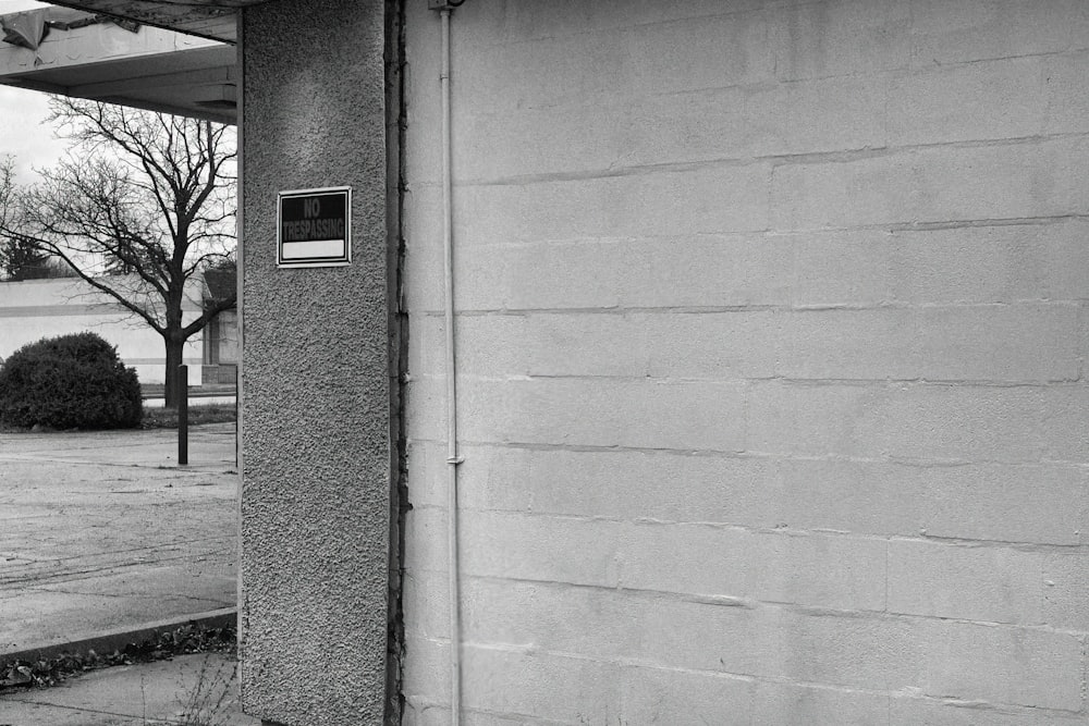 a black and white photo of a parking meter