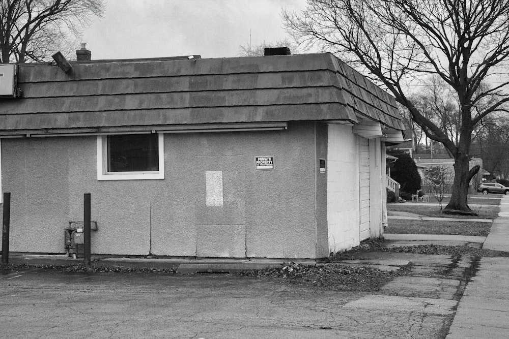 a black and white photo of a small building