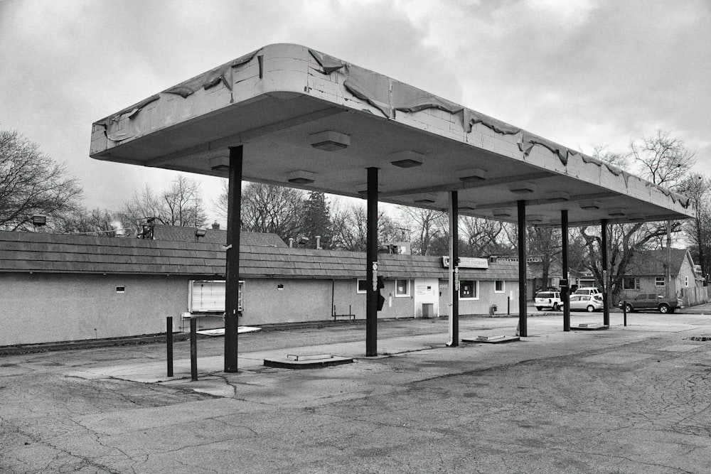 a black and white photo of a gas station