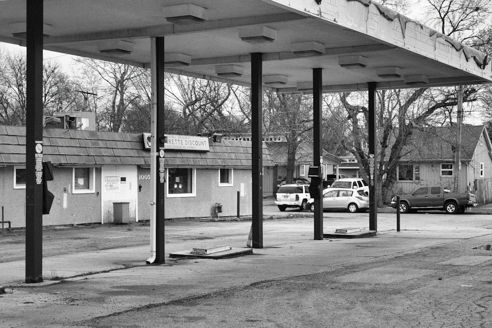 a black and white photo of a gas station