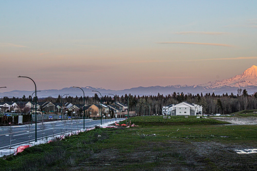 a view of a street with a mountain in the background