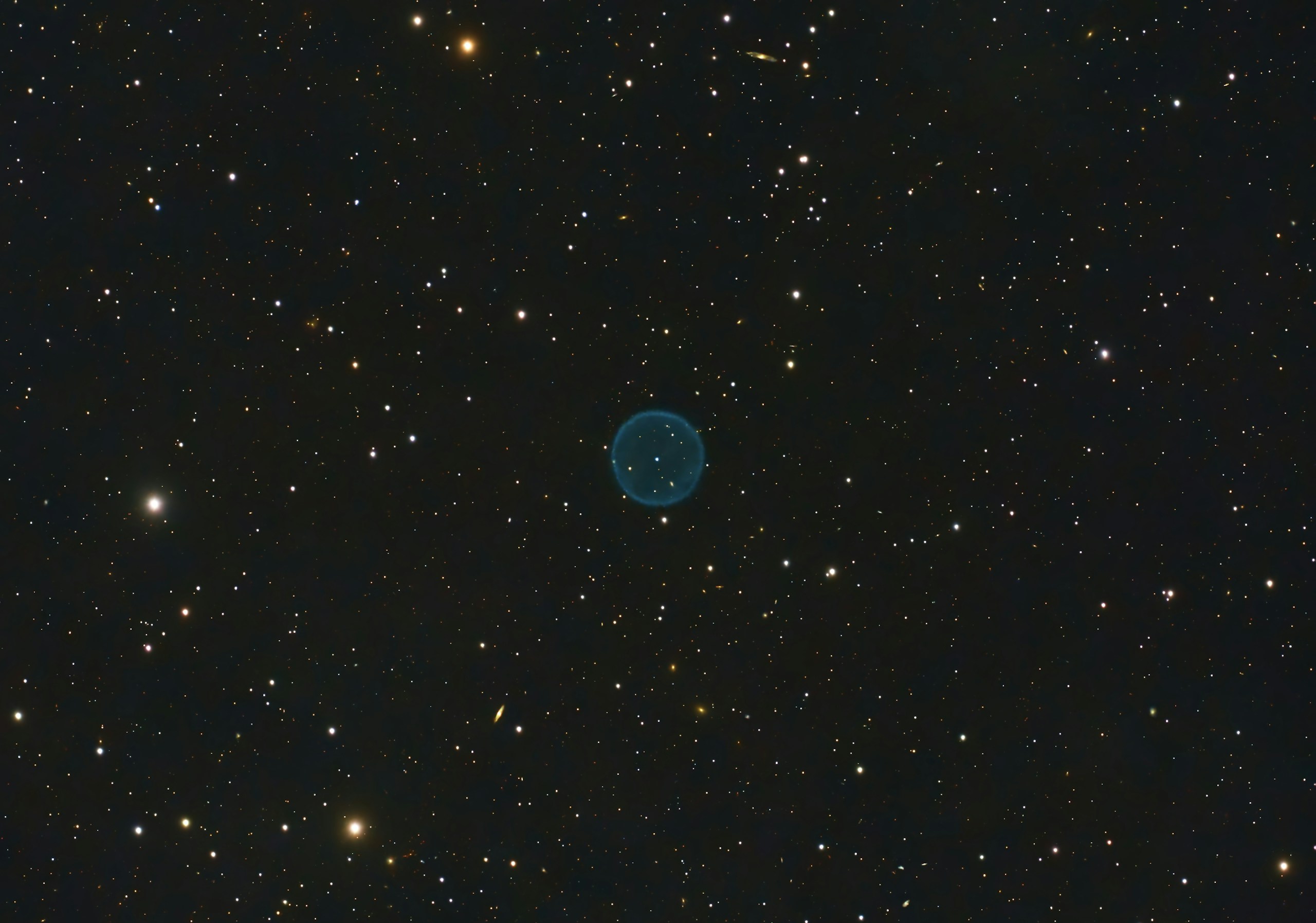 a blue object in the middle of a black sky