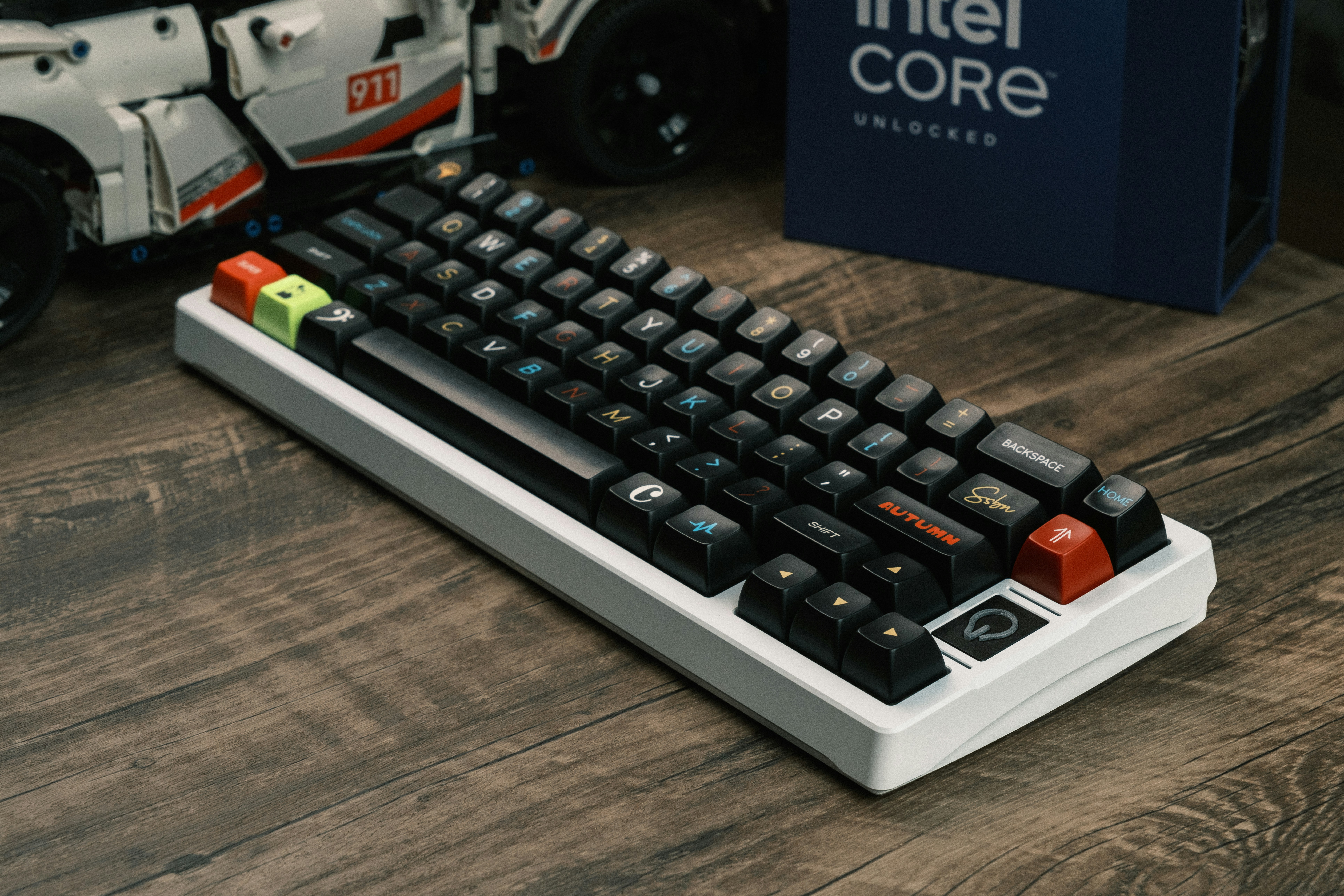 a computer keyboard sitting on top of a wooden table