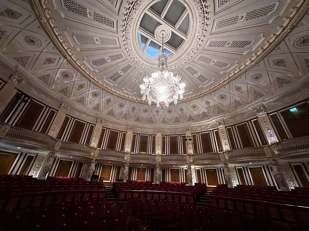 a chandelier hanging from the ceiling of a theatre