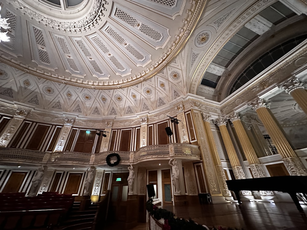 the ceiling of a large building with a chandelier