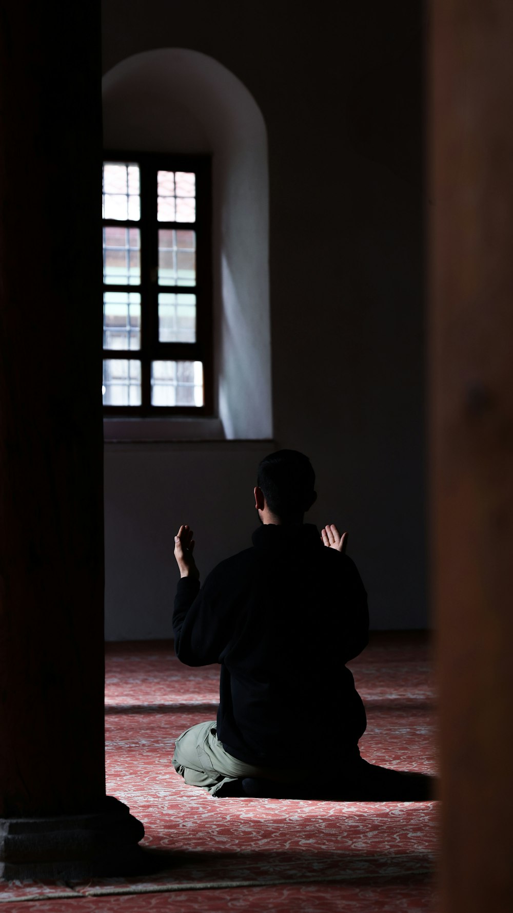 a person sitting on the floor in a room