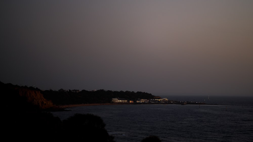 a dark sky over a body of water