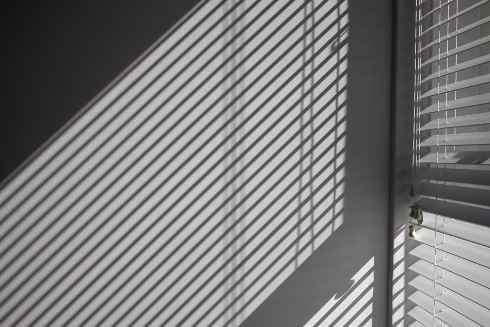 a close up of a window with blinds on it