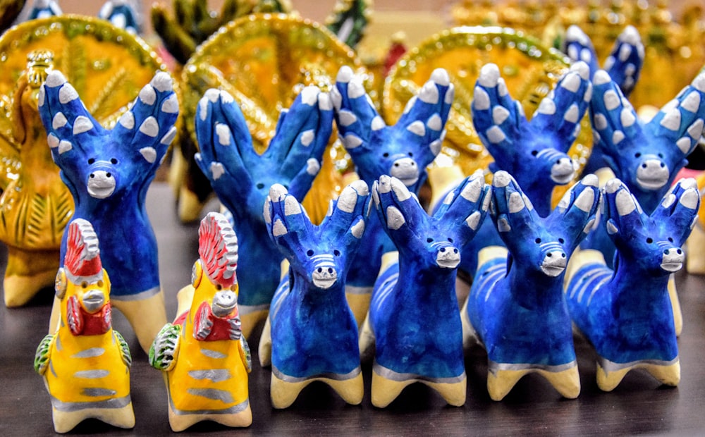 a group of ceramic figurines sitting on top of a table