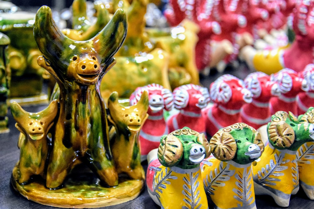 a group of ceramic figurines sitting on top of a table