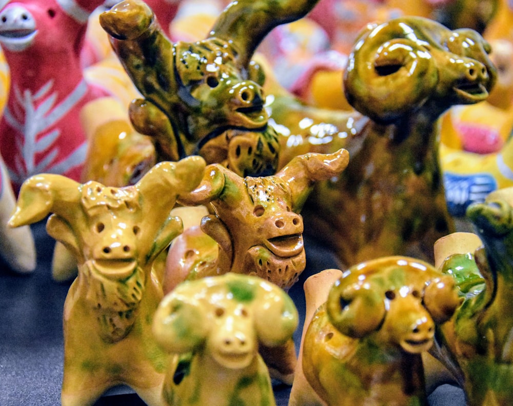 a group of ceramic animals sitting on top of a table