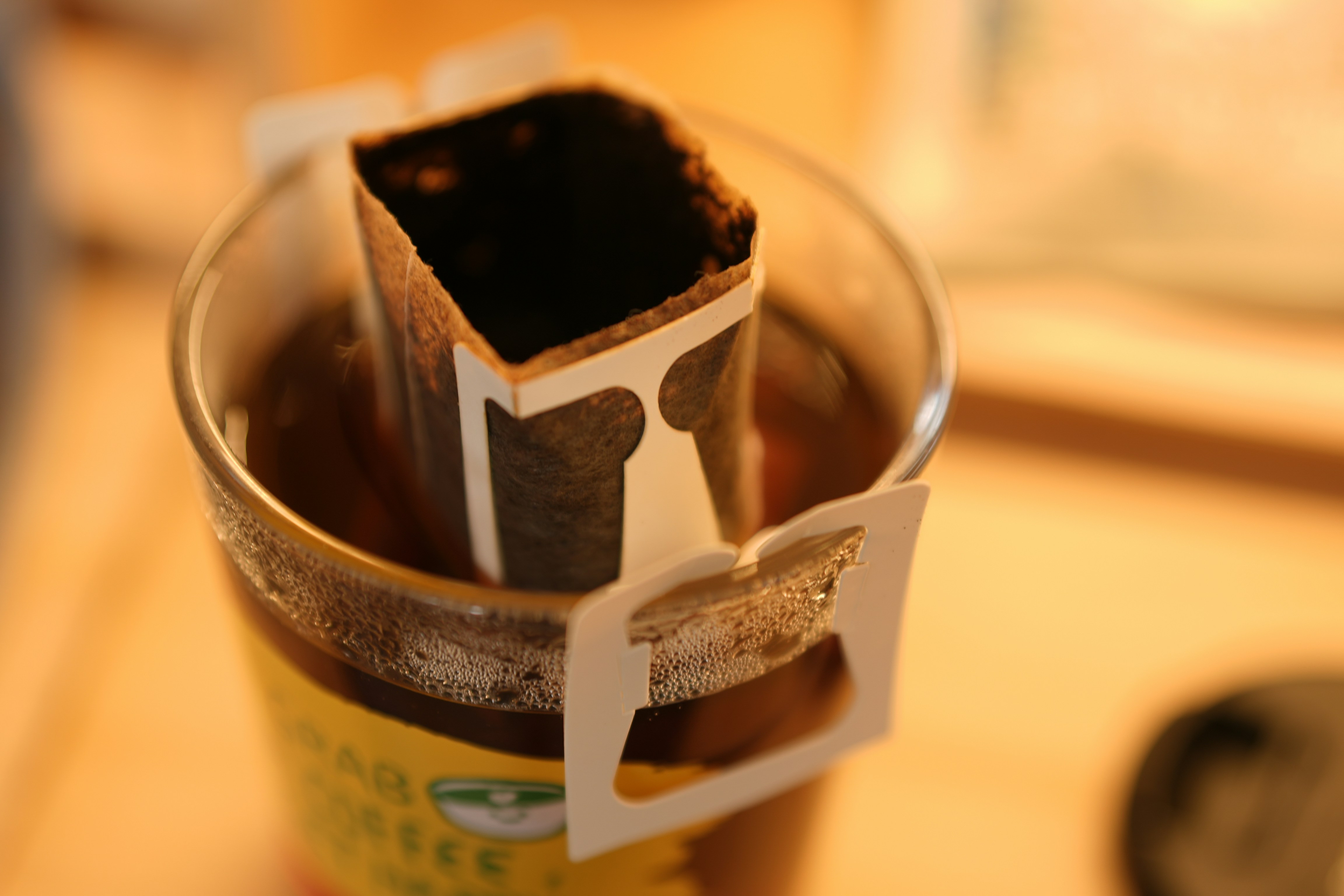 a close up of a cup of coffee on a table