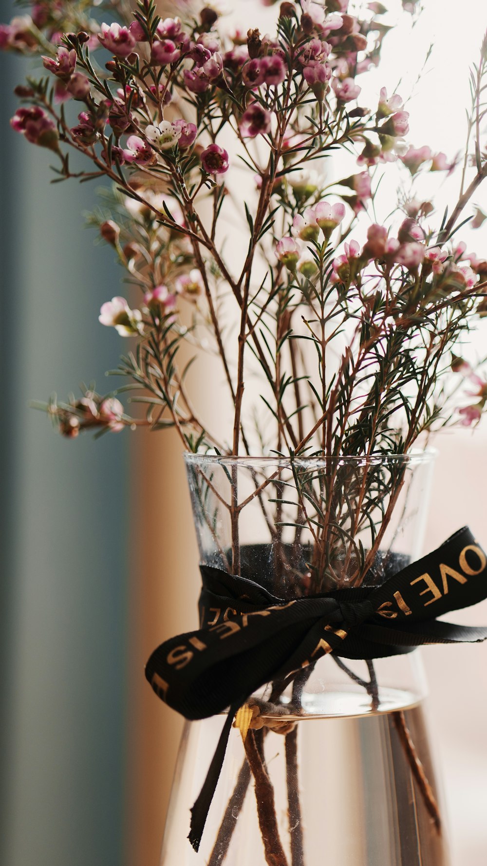 a glass vase filled with a bunch of flowers