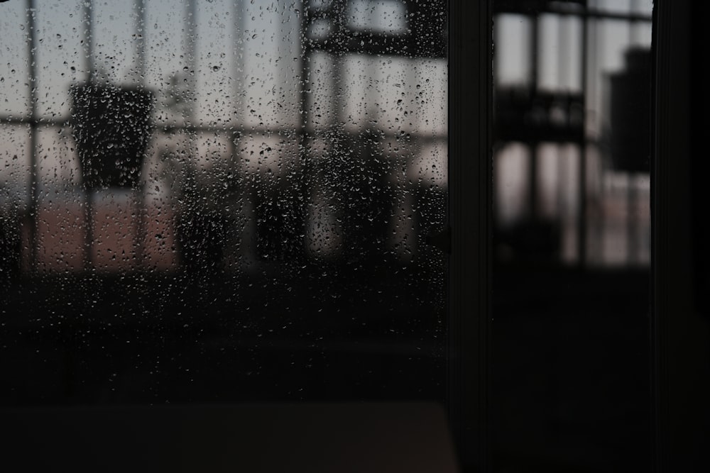 a window with rain drops on the glass