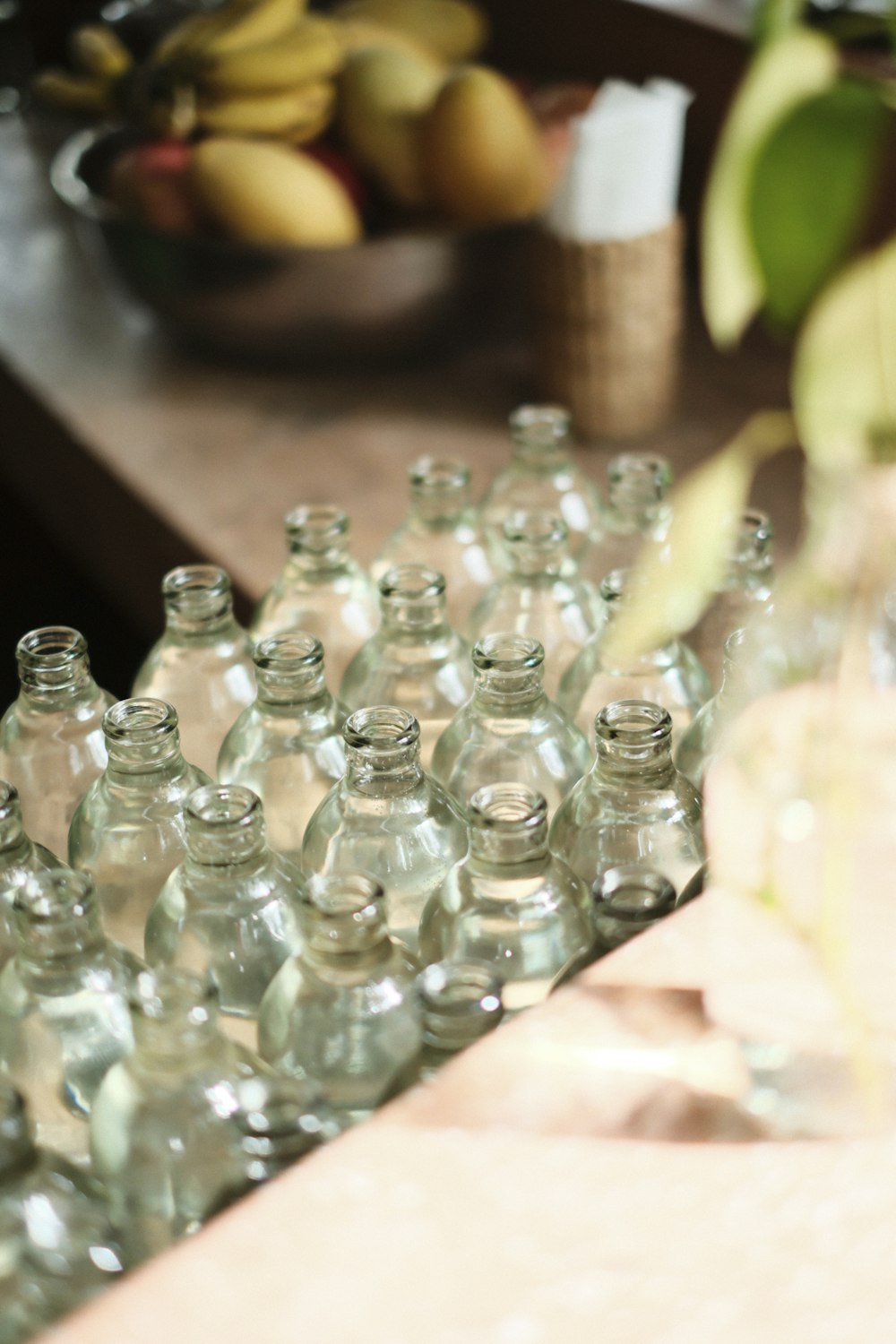 a bunch of empty glass bottles sitting on a table