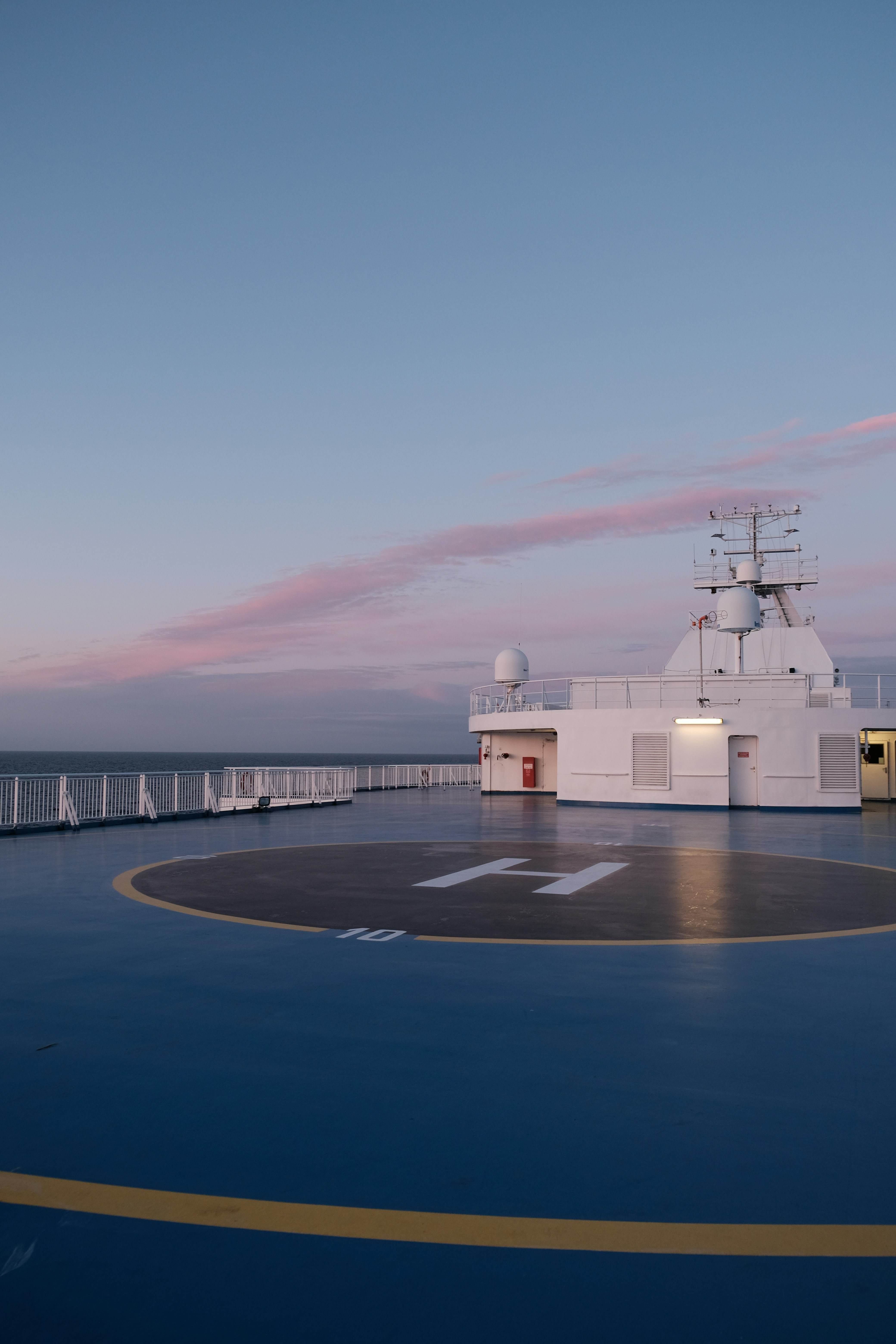 a large white ship sitting on top of a large body of water