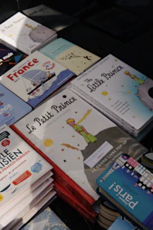 a pile of children's books sitting on top of a table