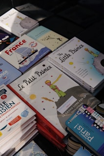 a pile of children's books sitting on top of a table