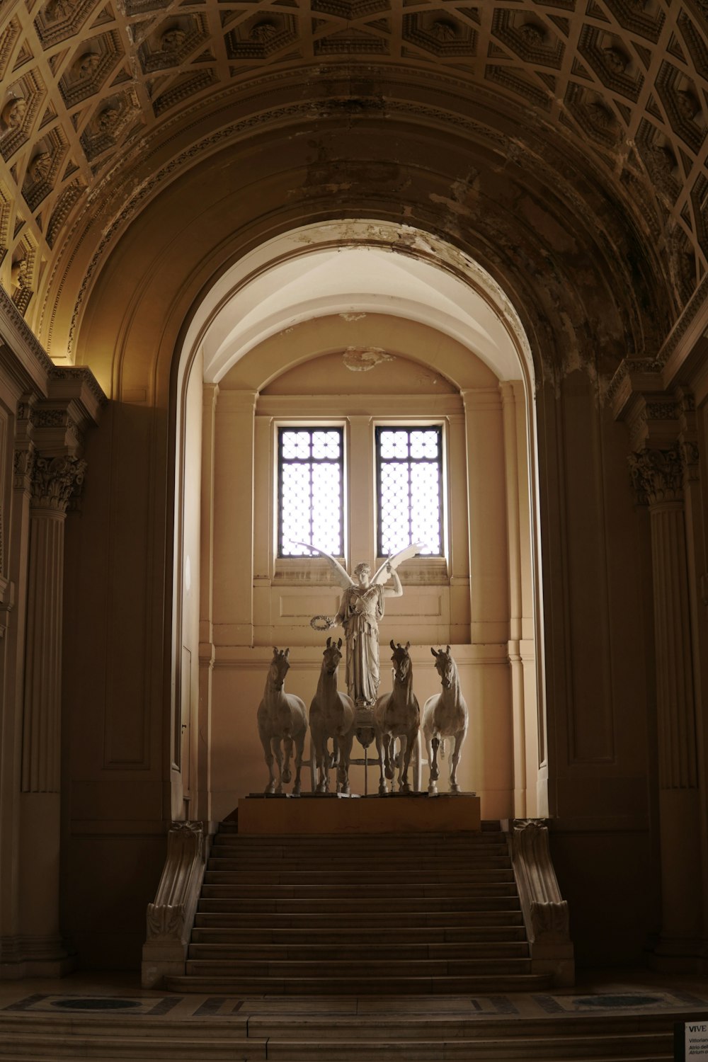 a statue of a person surrounded by animals