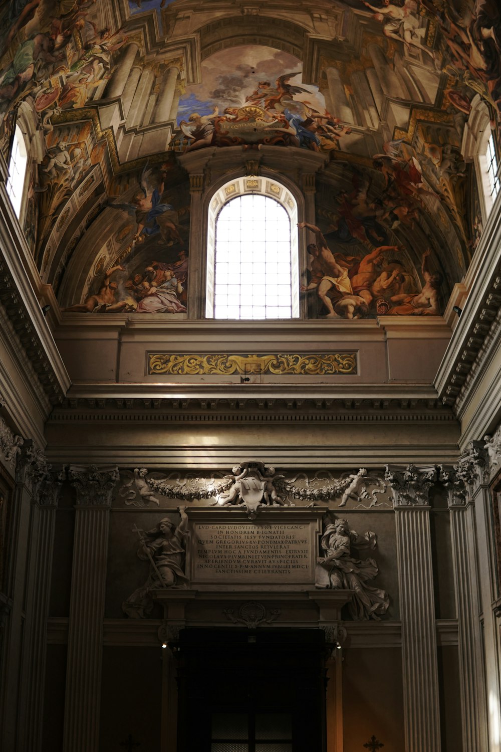 the ceiling of a building with a painting on it