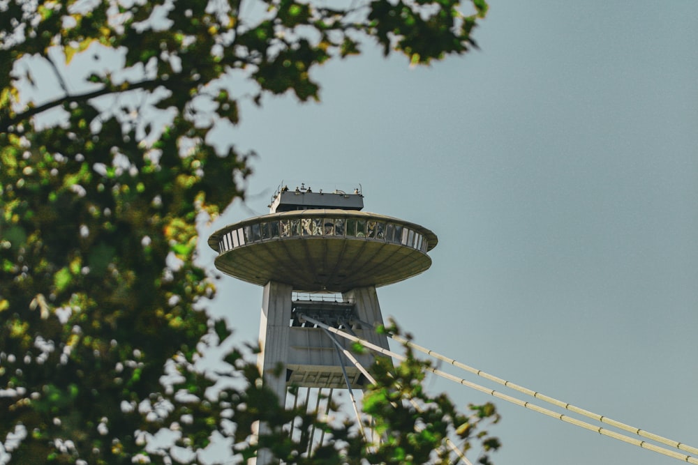 a very tall tower with a clock on it's side