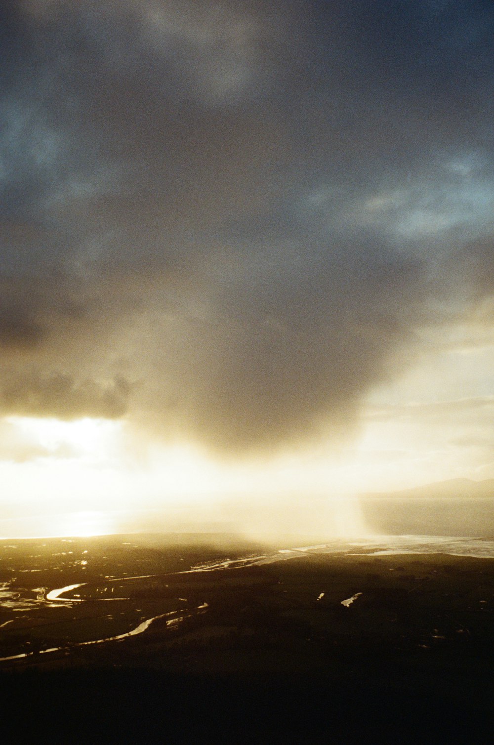 the sun is shining through the clouds in the sky