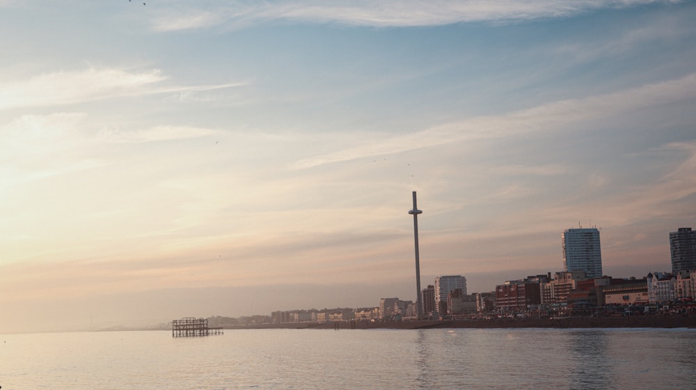 a body of water with a city in the background