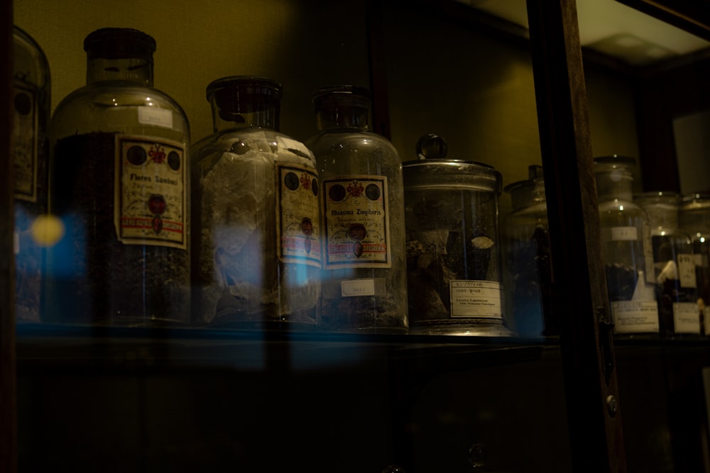 a shelf filled with lots of bottles and jars