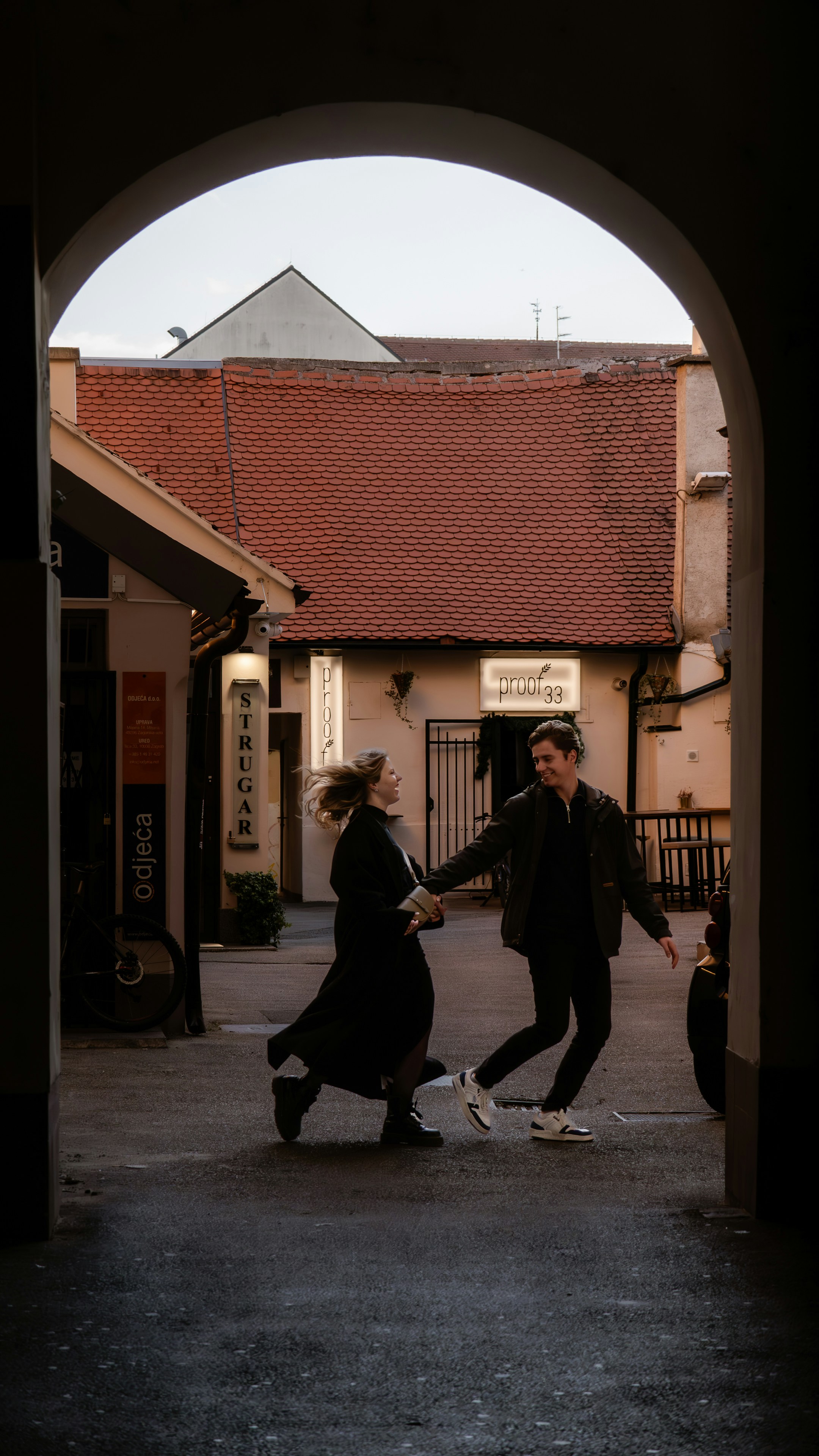 a couple of people that are dancing in the street