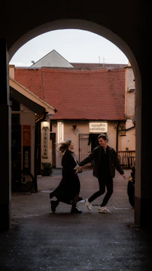 a couple of people that are dancing in the street