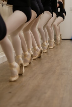 a row of mannequins wearing ballet shoes