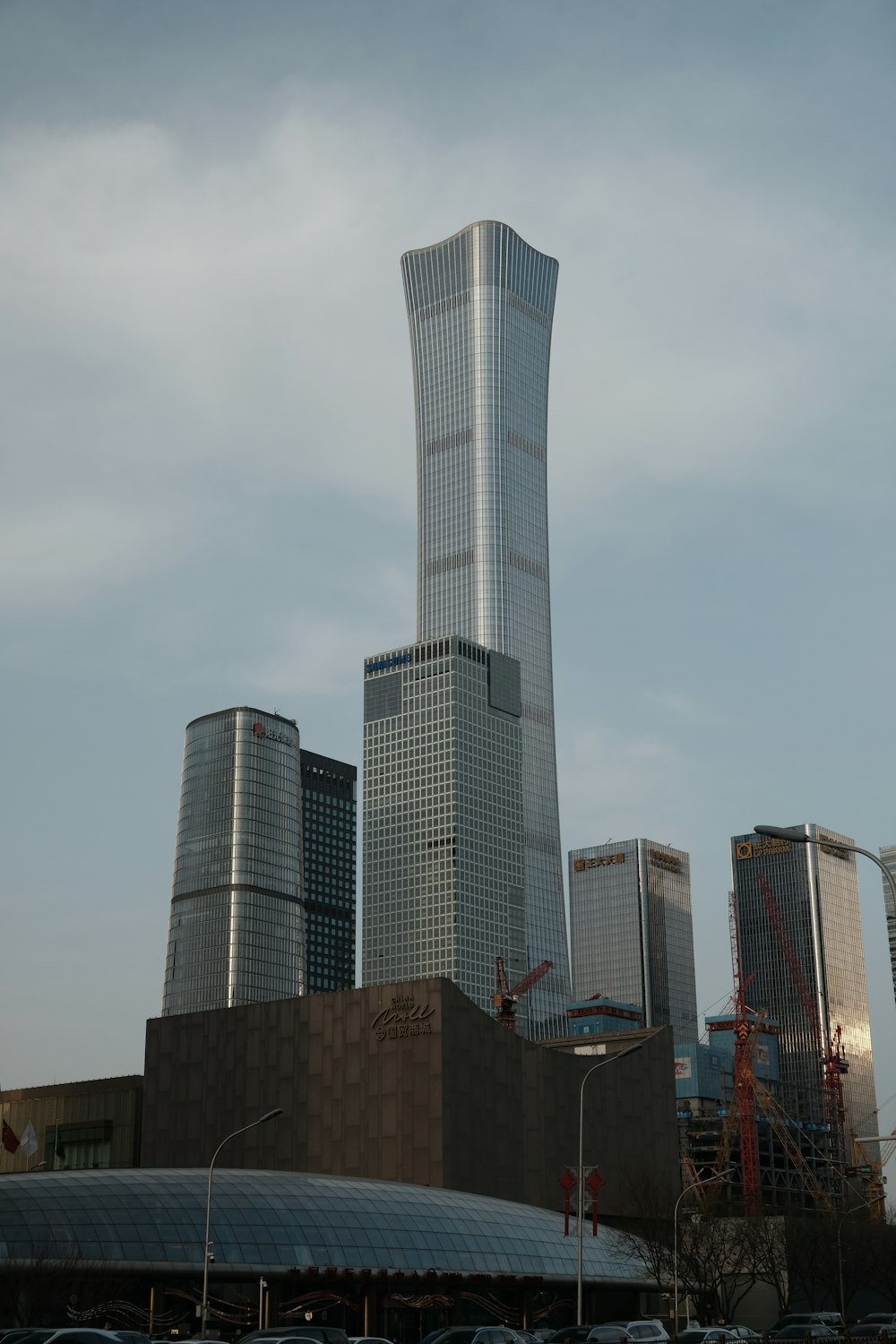 a very tall building towering over a city