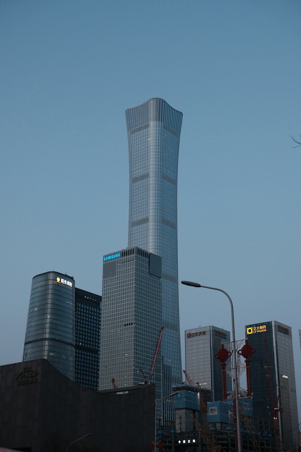 a very tall building towering over a city