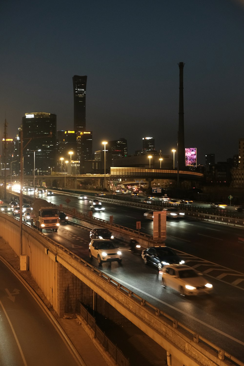 a busy highway with lots of traffic at night