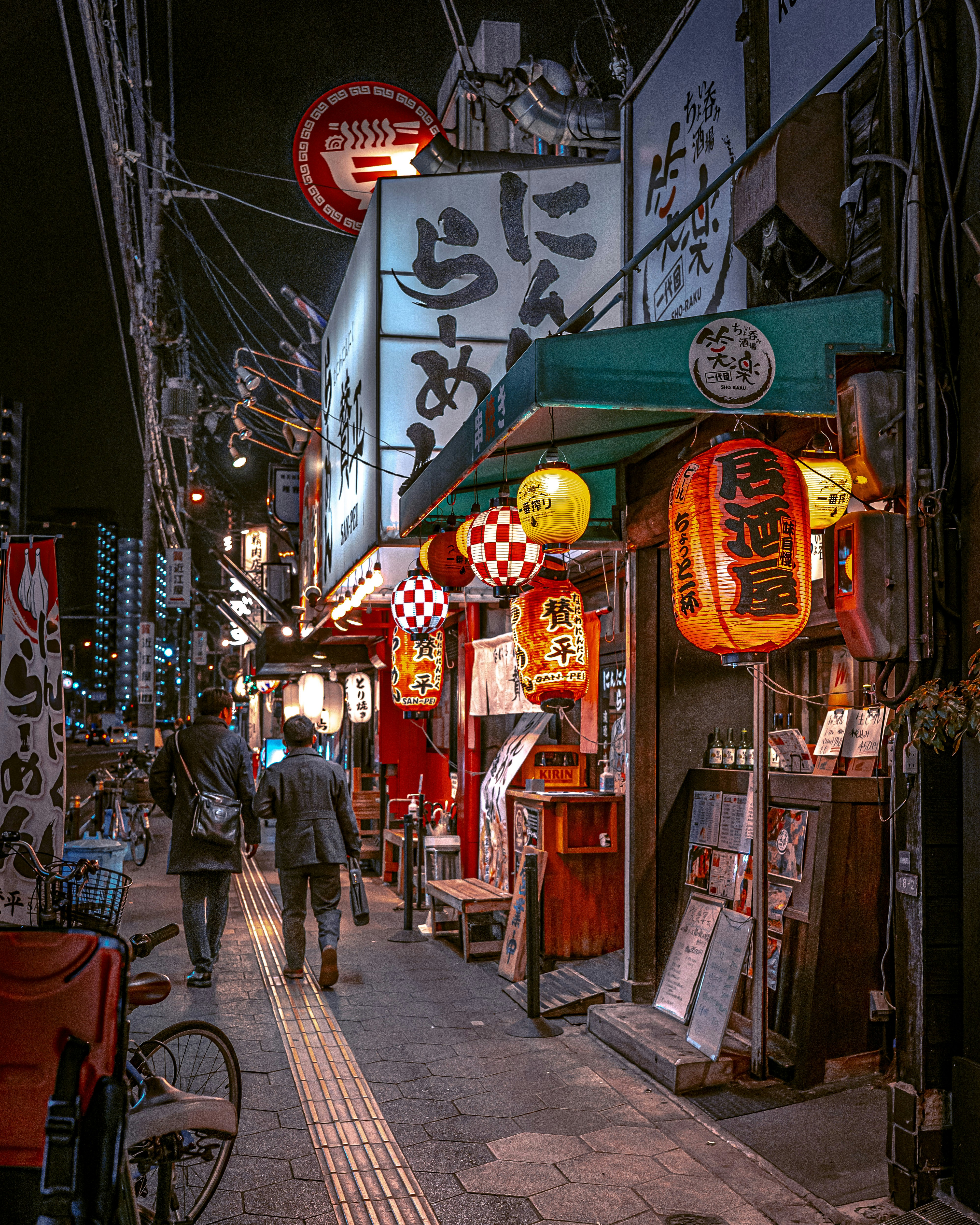 a couple of people that are walking down a street