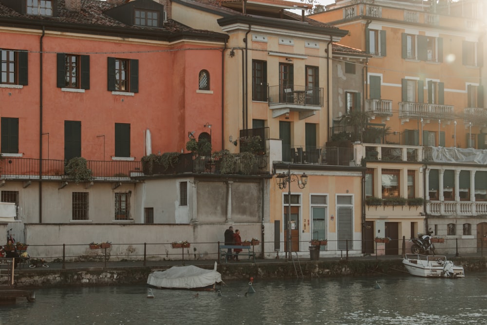 a row of buildings next to a body of water