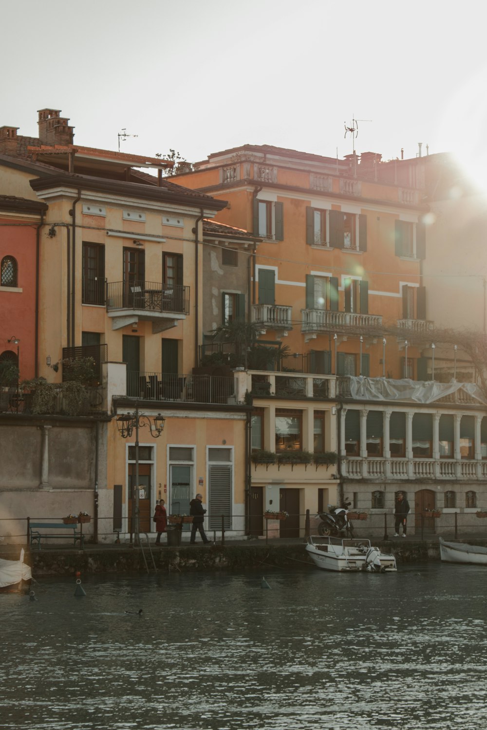 a body of water with a bunch of buildings in the background