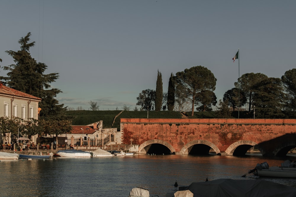 a bridge over a body of water next to a building