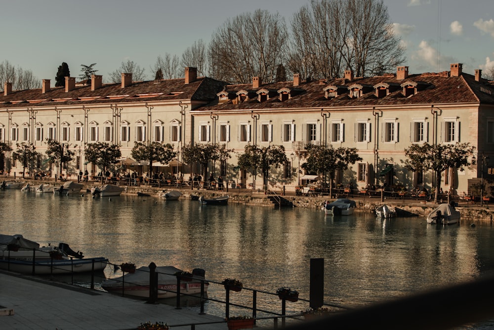 a row of buildings next to a body of water