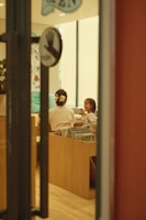 a group of people sitting at a table in a room