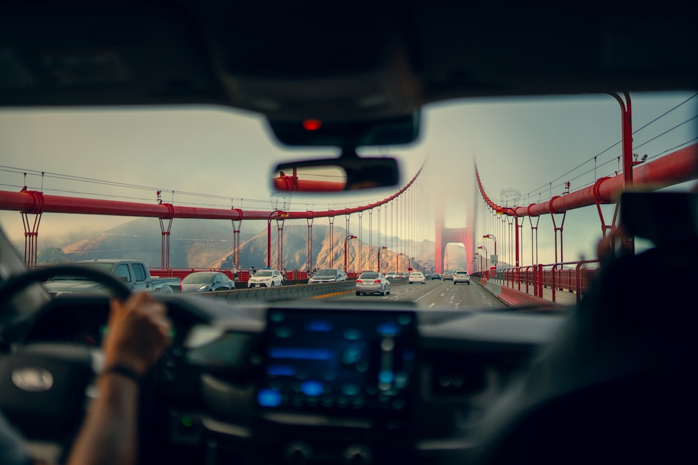 a view of the golden gate bridge from inside a car