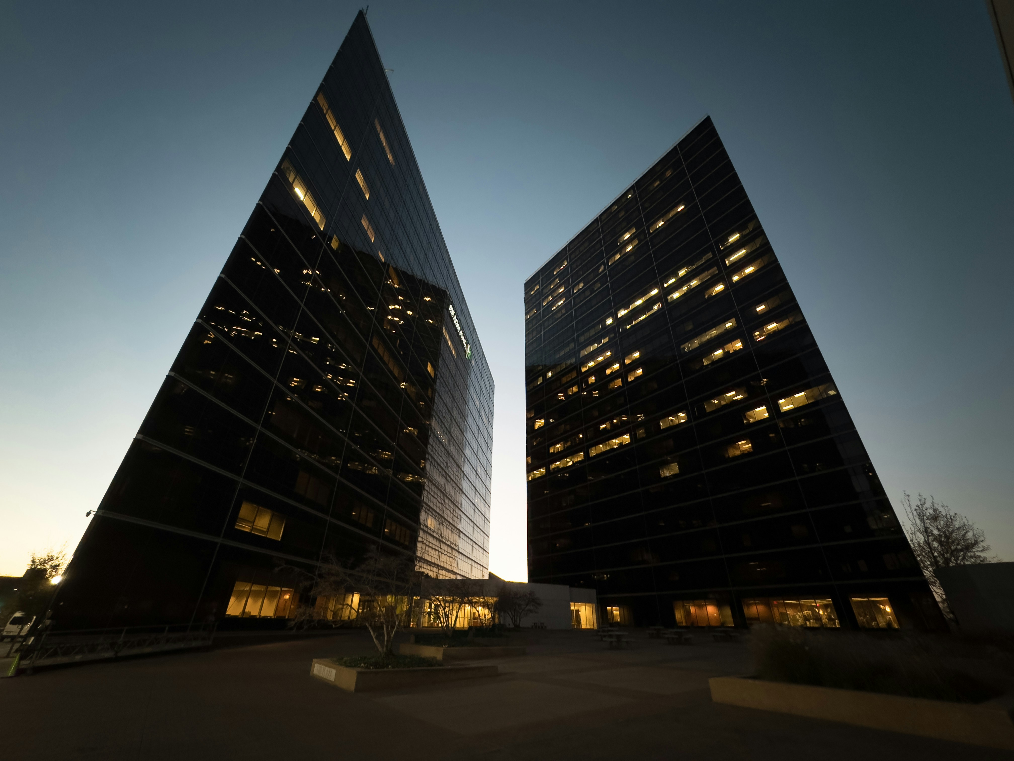 a couple of tall buildings sitting next to each other